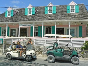 Golf buggies parked outside a restaurant on Harbour Island