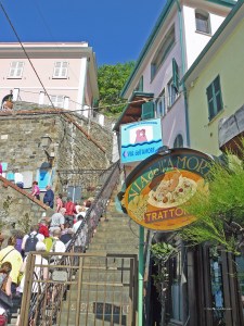 People climbing steps at the start of the Lovers' Walk in Riomaggiore
