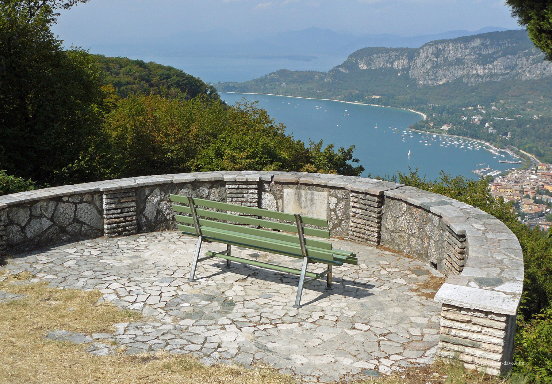 A green bench overlooking Lake Garda