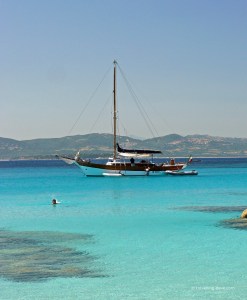 A boat and a dingy on the water