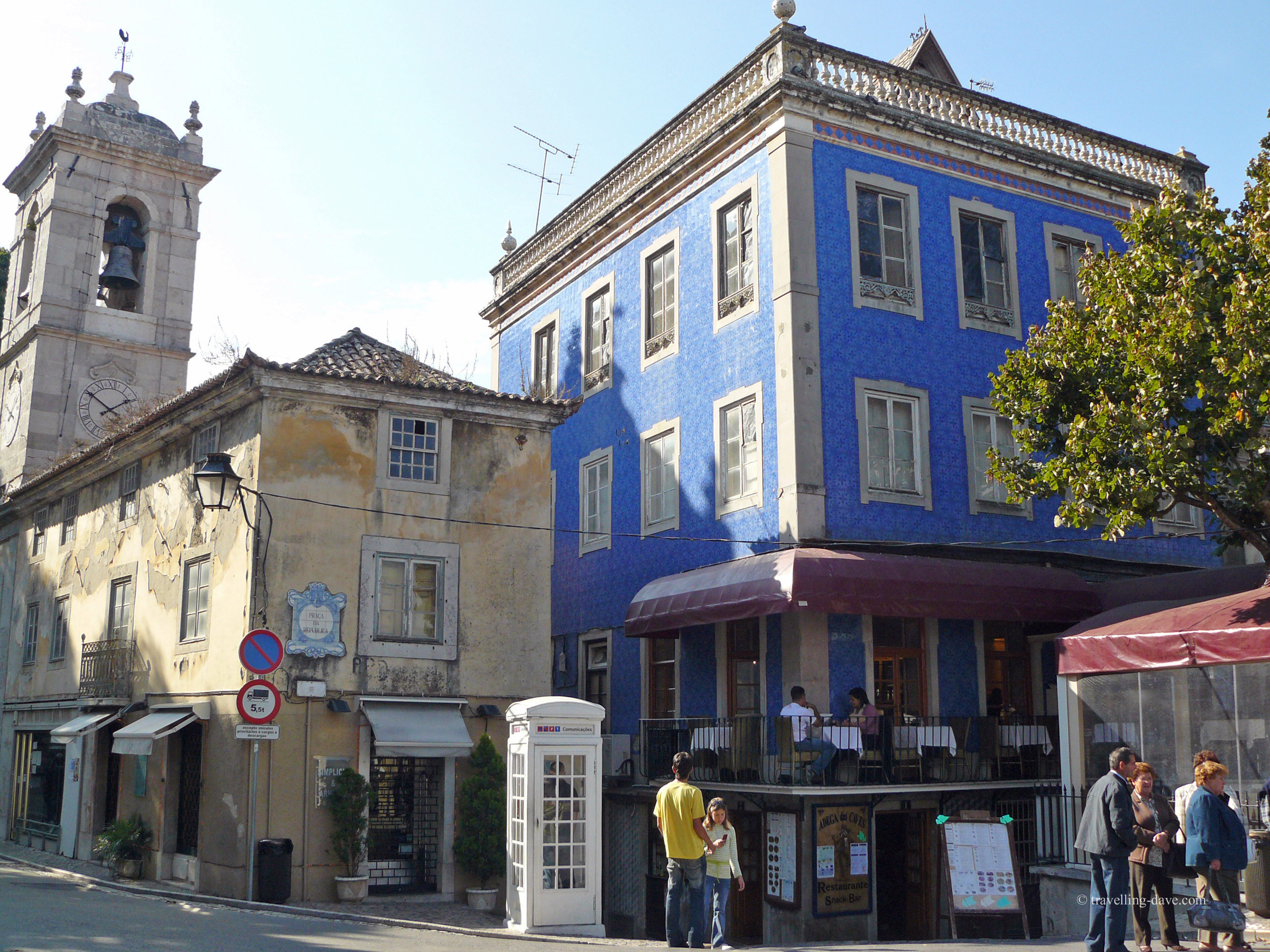 A blue building next to a church in Sintra