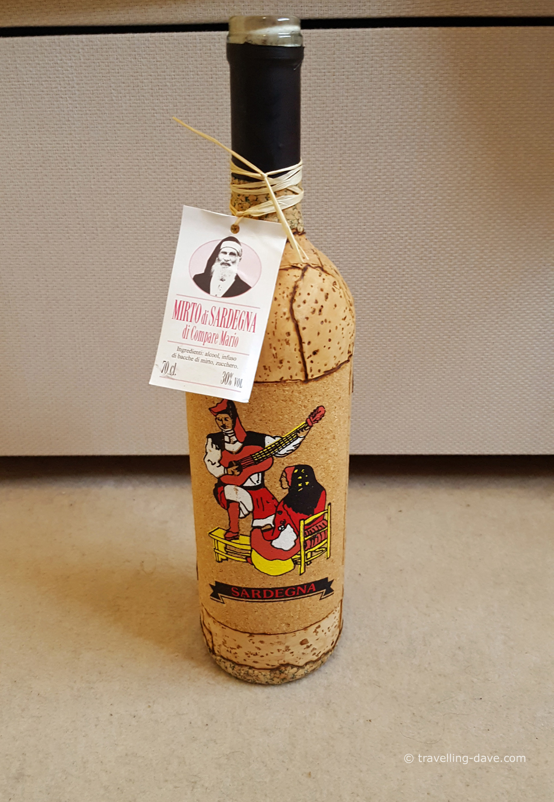 A cork covered bottle of mirto