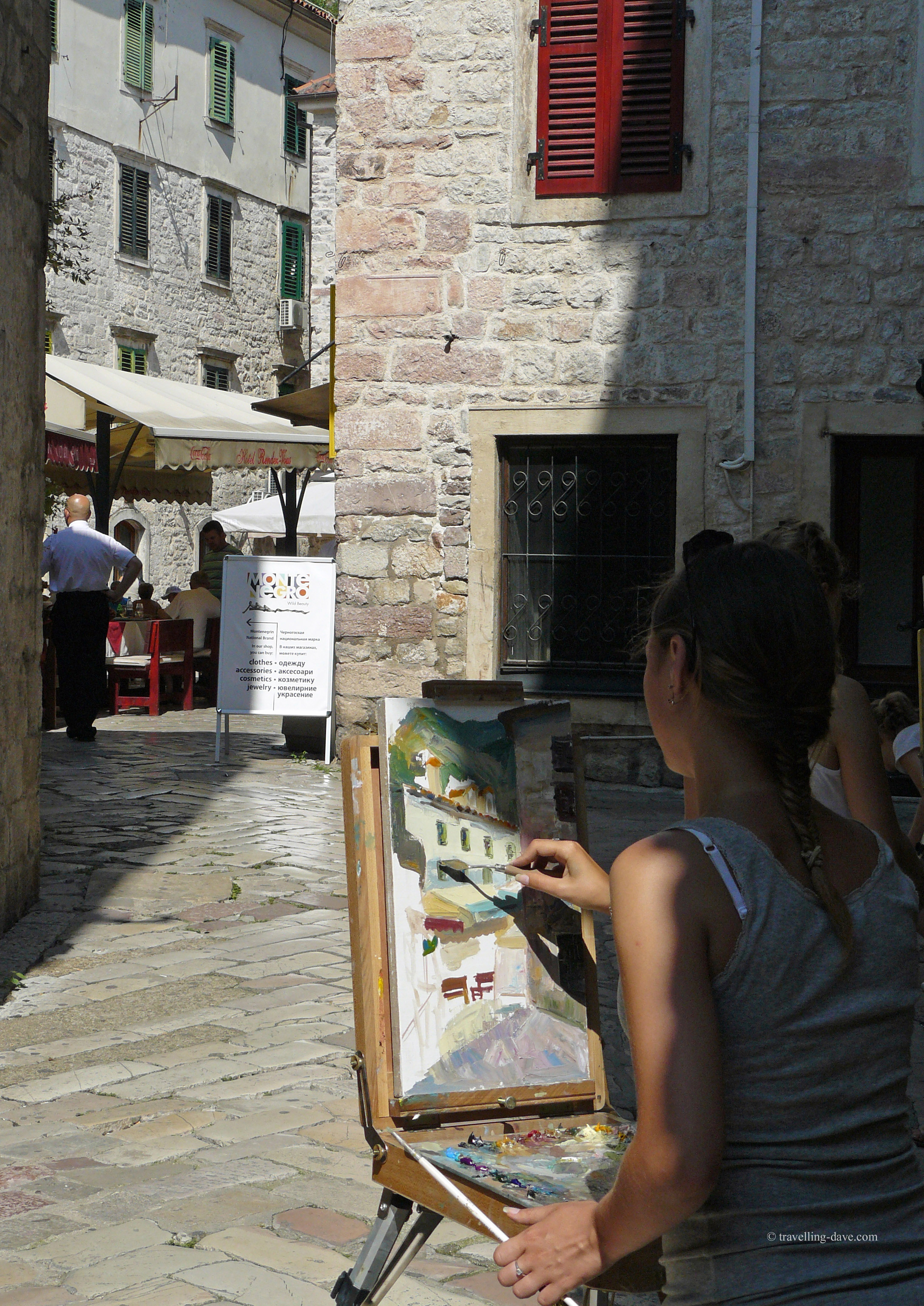 Girl painting in Kotor Old Town
