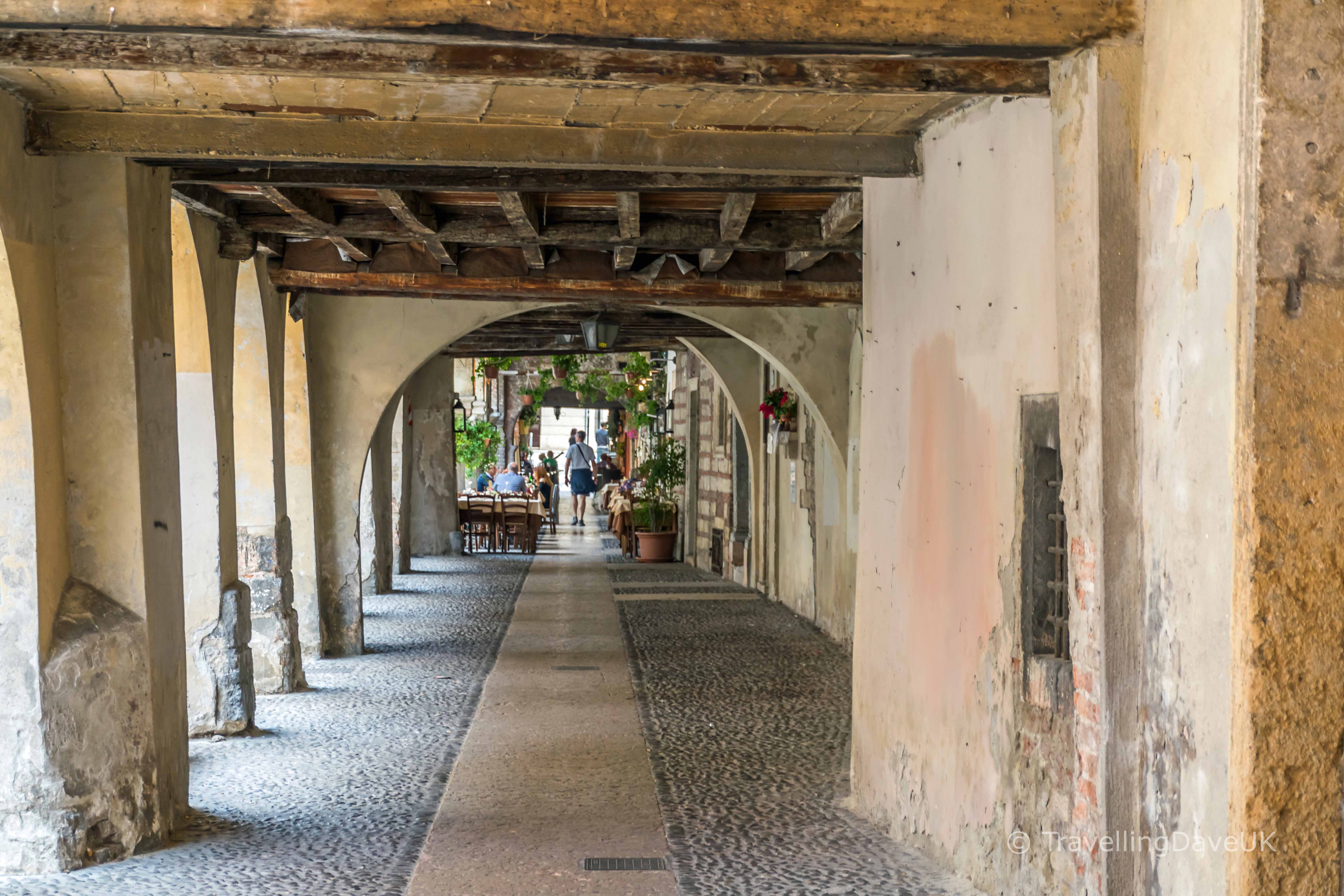 Looking down an arcade passage in Verona