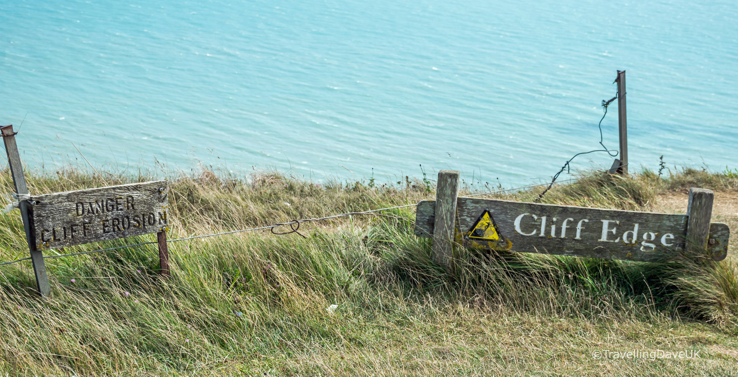 View of the warning signs at Beachy Head cliff edge