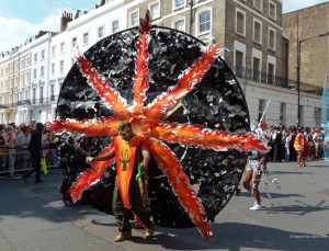 A man wearing a black and orange costume