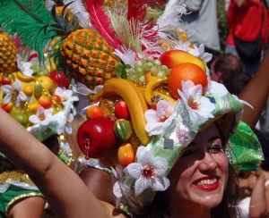 A woman wearing a fruit headgear