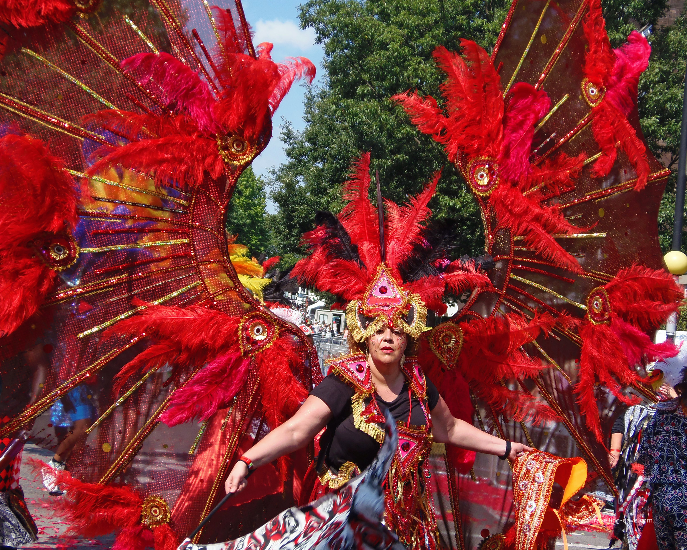 A woman wearing a red winged costume