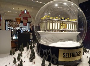 Giant snow globe in the window at Selfridges