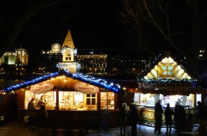 Christmas market stalls lit up at night
