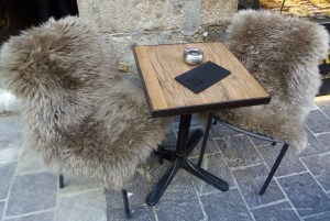 Two chairs and a table of a cafe'