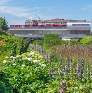 View of a red train from the Thames Barrier Park