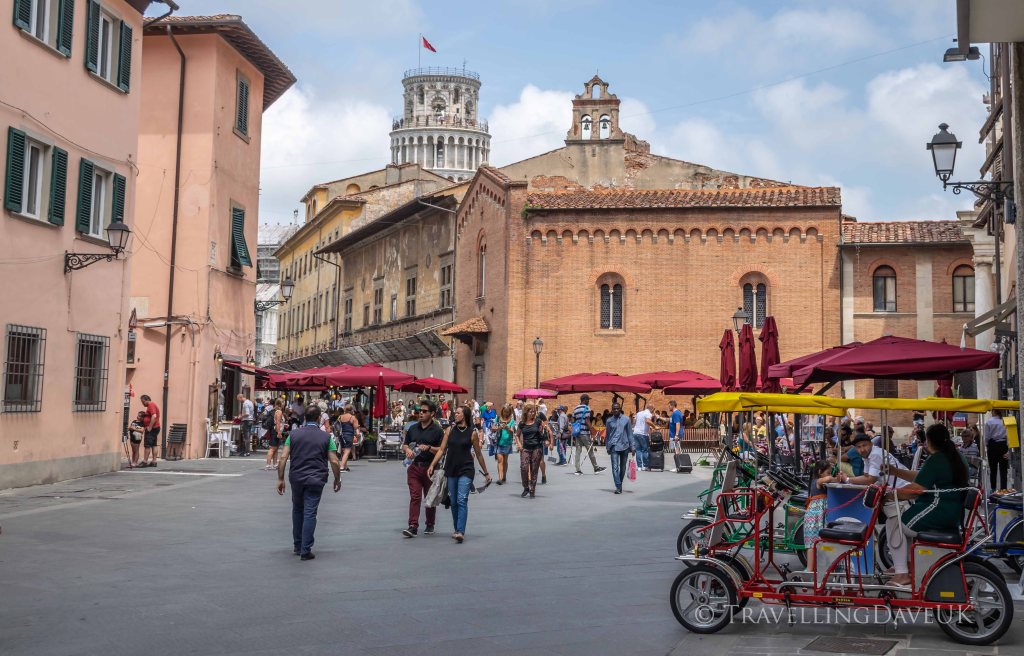 People walking in Pisa city centre in Italy