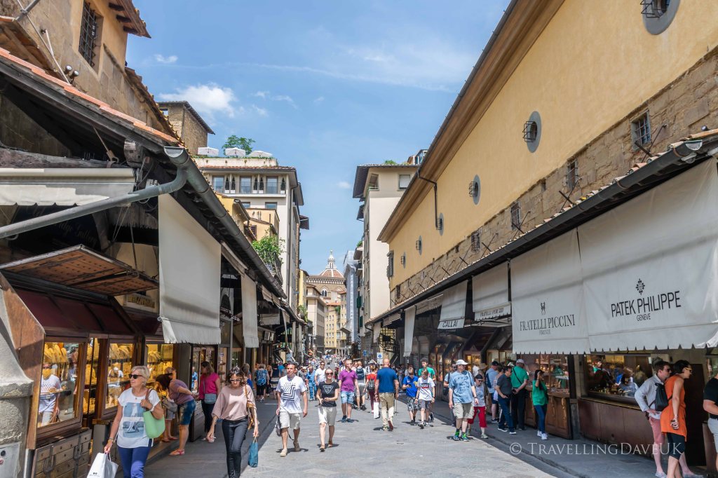View of people and shops on Ponte Vecchio in Florence in Italy